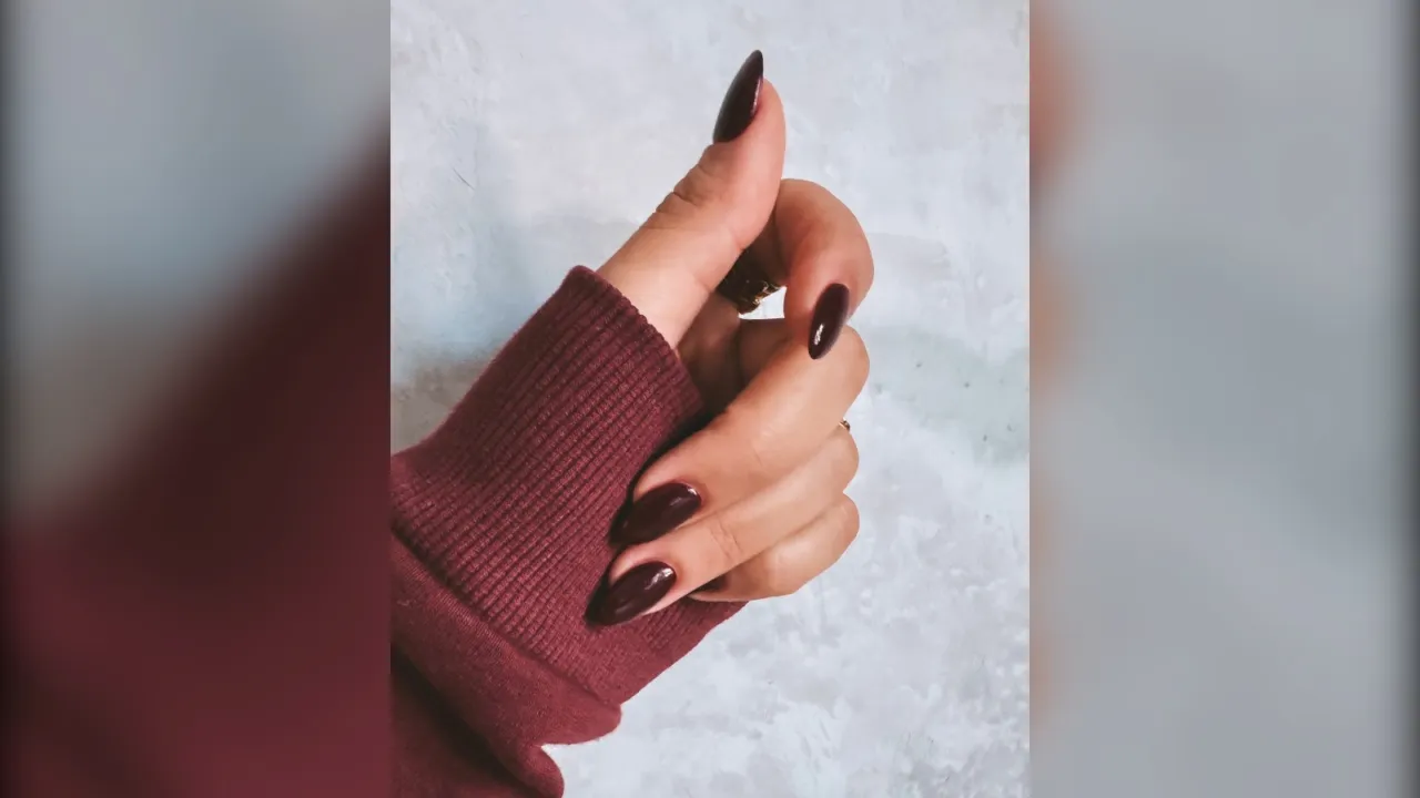 Long almond deep wine burgundy nails with a burgundy sweater