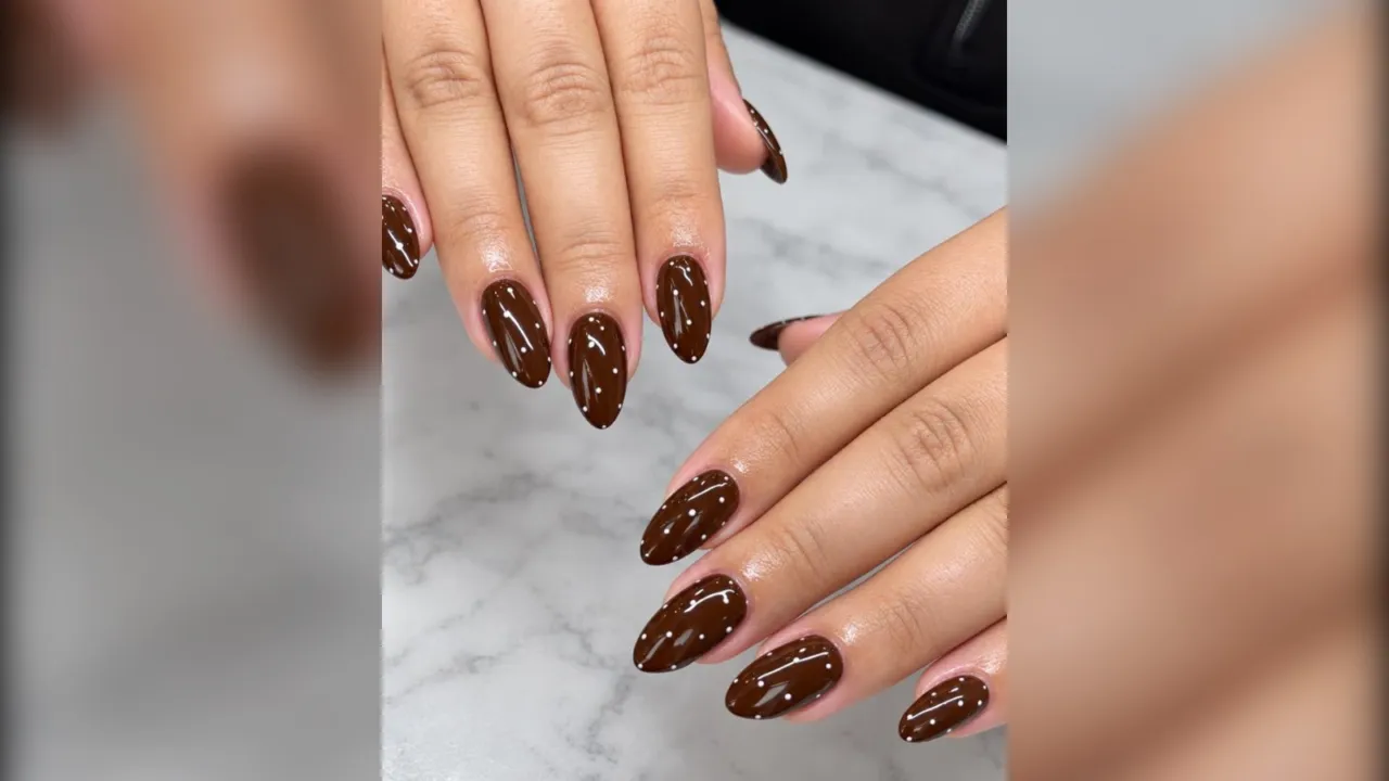 Chocolate brown almond nails with tiny white dots