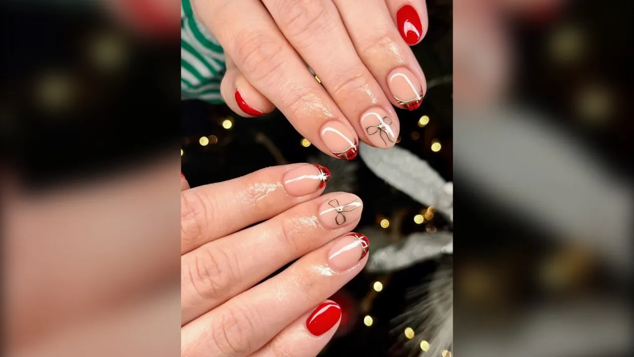 Short nude nails with tiny bows and red French tips, short Christmas nails