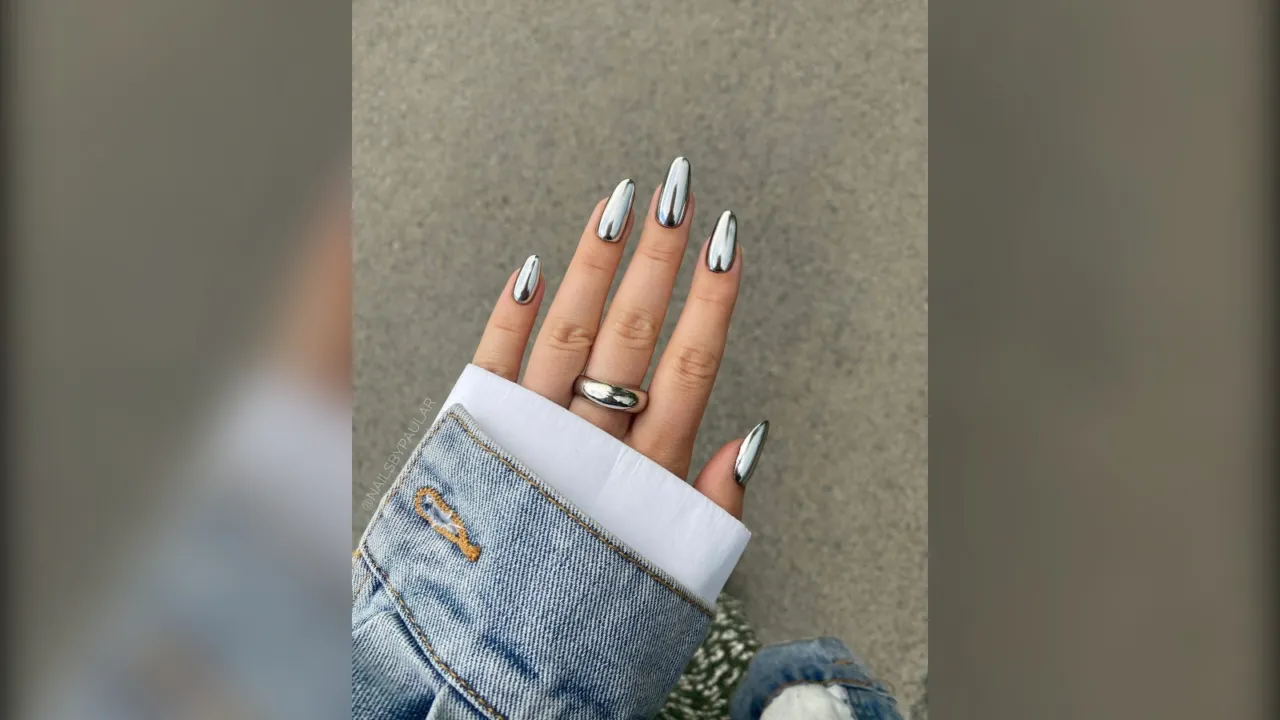 Almond nails in full mirror silver chrome with a denim jacket