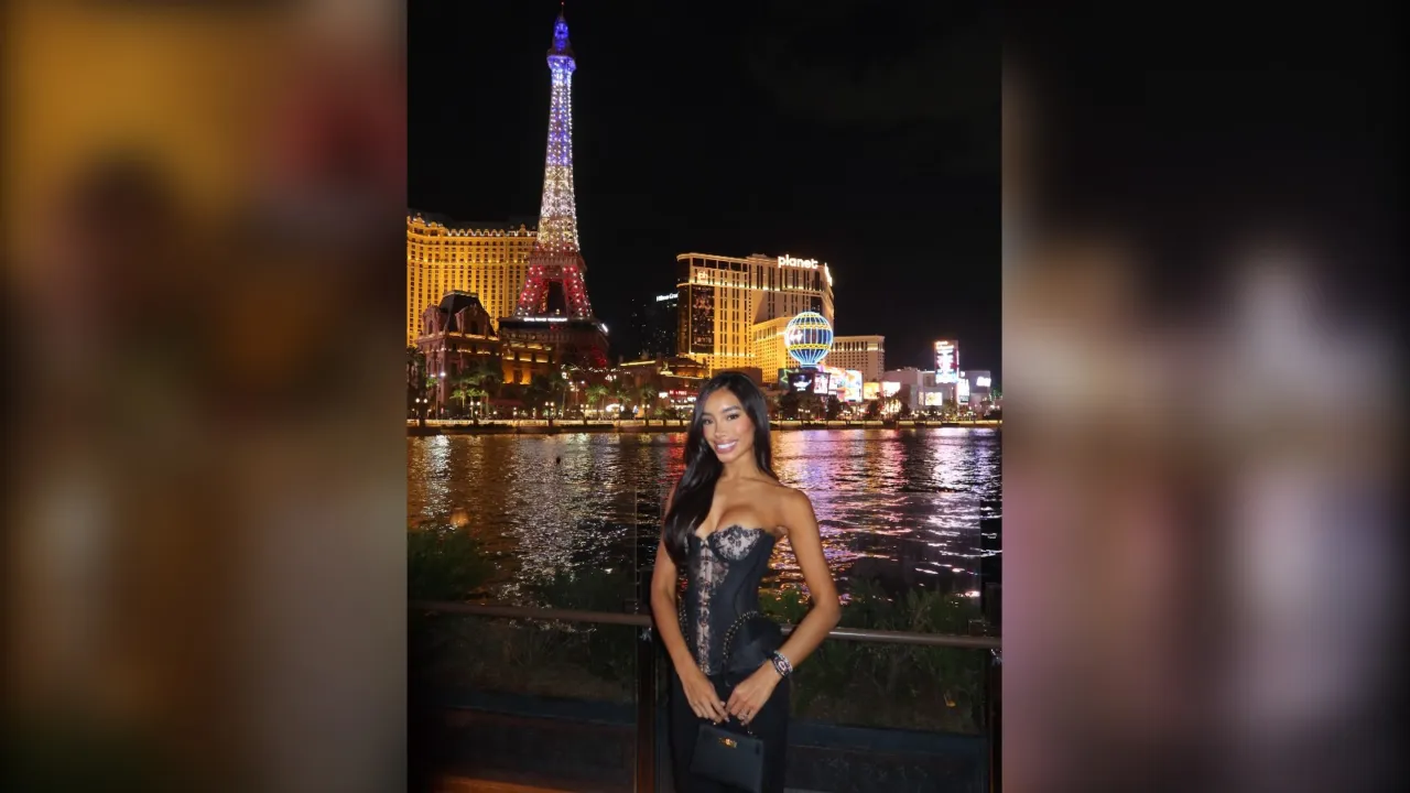 Woman in a metallic corset top by the Bellagio fountains at night, Vegas night out outfit for winter