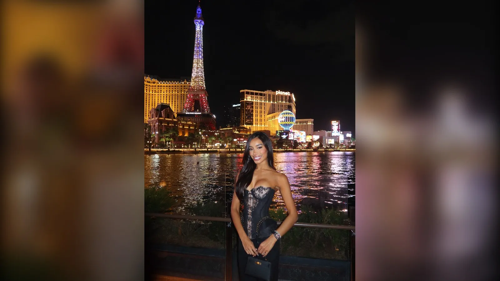 Woman in a metallic corset top by the Bellagio fountains at night, Vegas night out outfit for winter