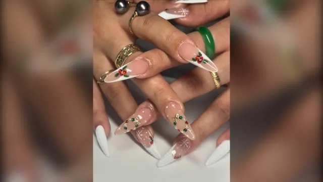Long white French tip nails with small 3D holly berries
