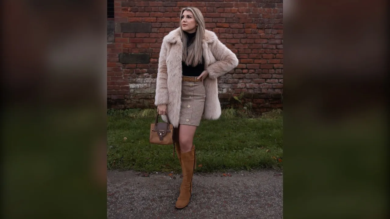 Woman in a pink faux fur coat, check mini skirt and tan knee boots, winter brunch outfit