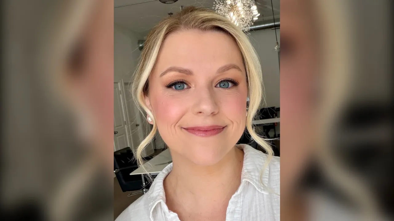 Woman with blue eyes wearing apricot eyeshadow and icy pink blush